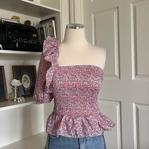 Pink and blue floral ruffle shoulder top with a smocked elasticated back.